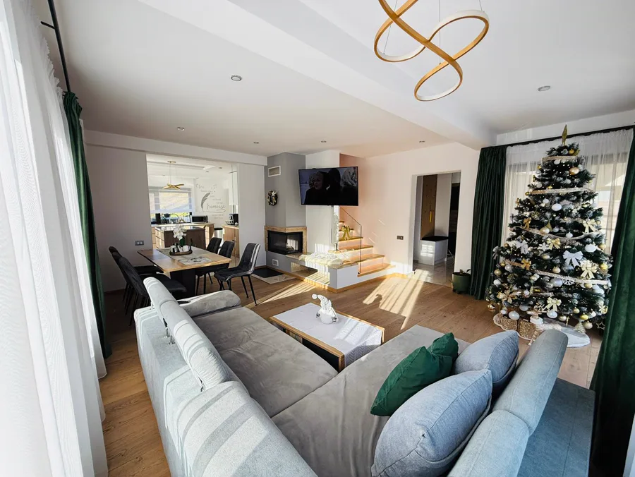 Spacious Christmas living room with a view towards the kitchen